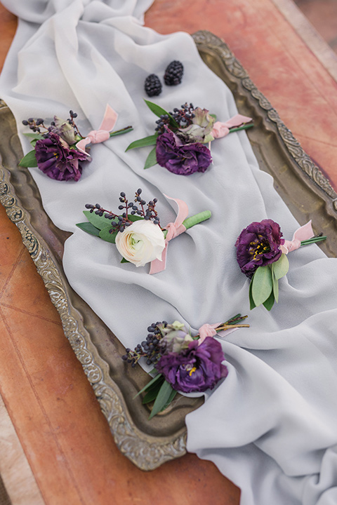 rancho-las-lomas-wedding-boutionneres-with-purple-flowers