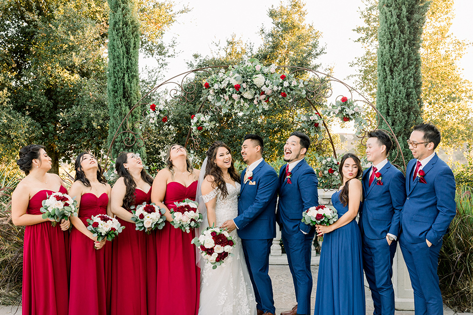  groomsmen in blue suits and groomslady in a blue dress