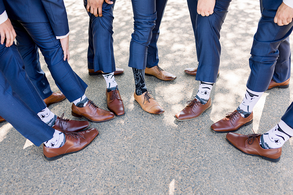 Circle-Oak-ranch-wedding-groom-and-groomsmen-socks-with-star-wars-themes-on-them