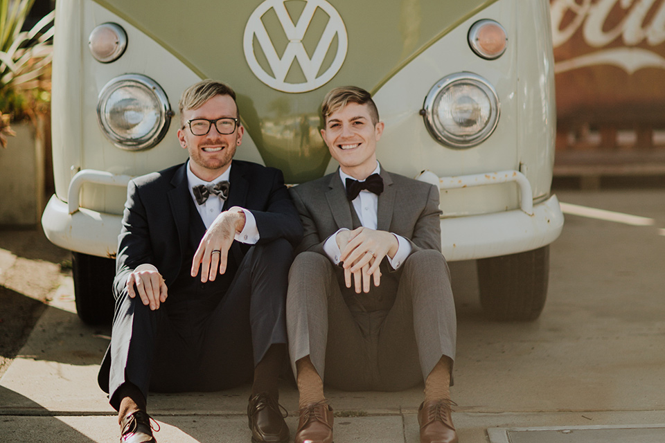 Sunset-Cliffs-Shoot-grooms-by-van-one-groom-in-a-grey-suit-with-the-other-groom-in-a-blue-suit