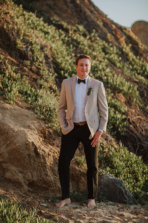 Sunset-Cliffs-Elopement-groom-in-a-tan-suit-coat-with-black-pants-and-black-bow-tie