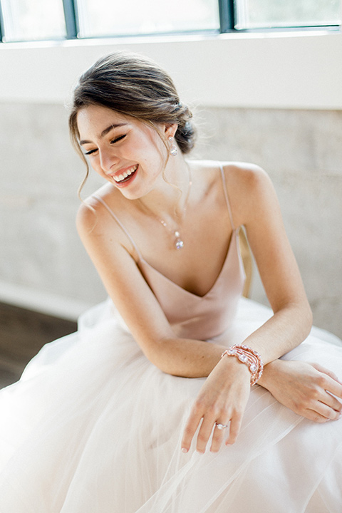 The-1912-Shoot-bride-sitting-bride-in-a-tulle-ballgown-with-a-sweetheart-neckline