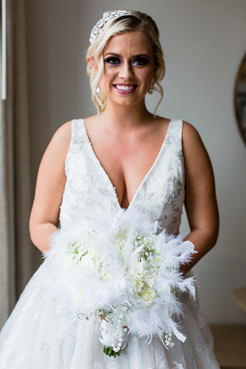 Belmar Hotel wedding bride in a white ballgown with a plunging deep v neckline and crystal detail on the bodice