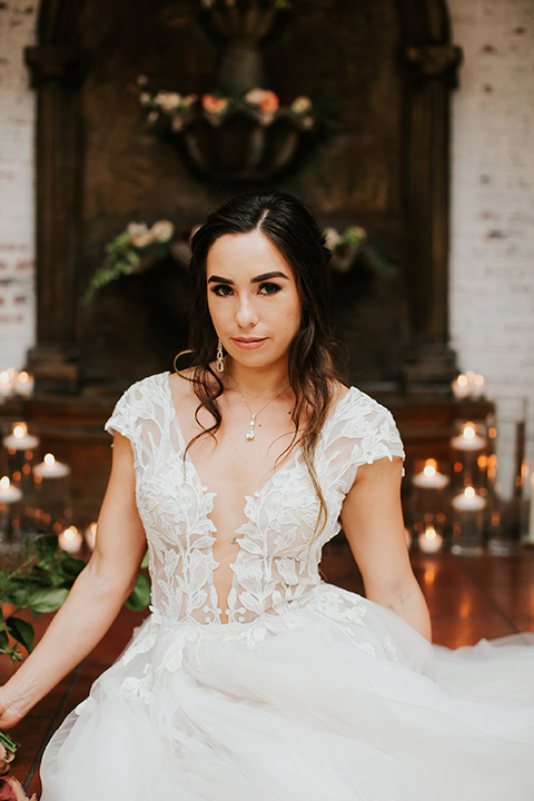 bride in a lace gown with a cap sleeve