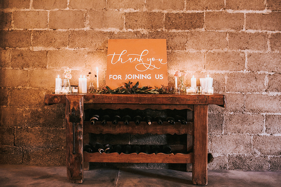 wooden table with candles and desserts