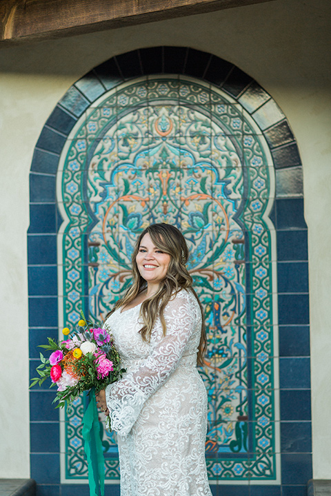 Topa-Winery-Wedding-bride-alone-in-a-lace-bohemian-style-gown-with-flutter-sleeves