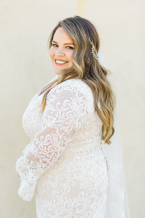 Topa-Winery-Wedding-bride-smiling-in-a-bohemian-gown-with-lace-detailing-and-flutter-sleeves