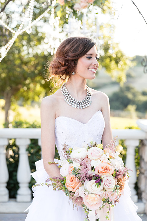 Vellano-Country-Club-bride-alone-in-a-big-ballgown-with-her-hair-up-in-a-side-bun