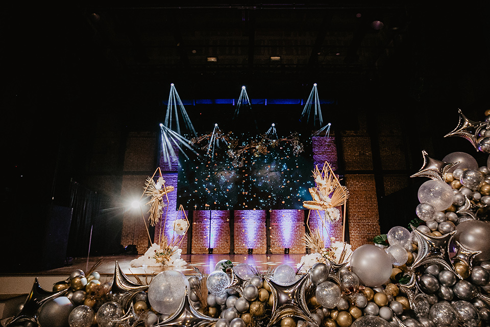 The-Yost-Theatre-theather-space-with-gold-and-silver-balloons-and-fun-bright-lighting