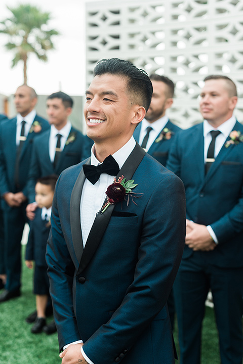 the-lautner-compound-wedding-groom-at-ceremony-the-bride-wore-a-formfitting-lace-gown-with-strap-groom-wore-a-blue-shawl-lapel-tuxedo