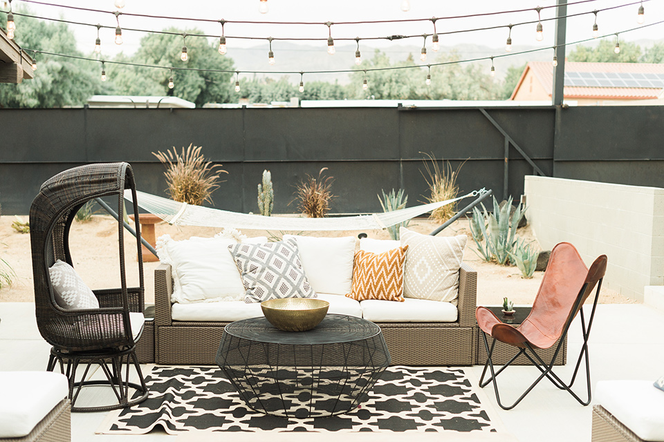 the-lautner-compound-wedding-reception-space-with-leather-chairs-and-geometric-rugs