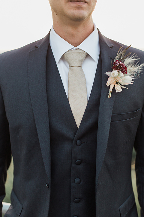 Temecula-outdoor-wedding-at-callaway-winery-groom-navy-suit-with-tie