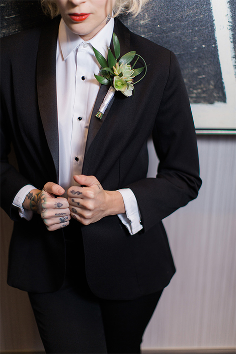 Black-shawl-lapel-female-tuxedo-styled-with-a-white-tuxedo-shirt-black-studs-and-cufflinks-and-no-neckwear