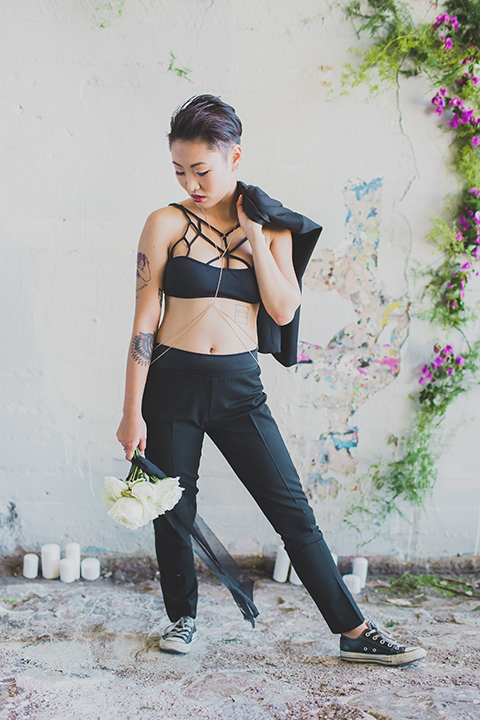 Los-angeles-same-sex-wedding-shoot-bride-black-womens-tuxedo-holding-jacket