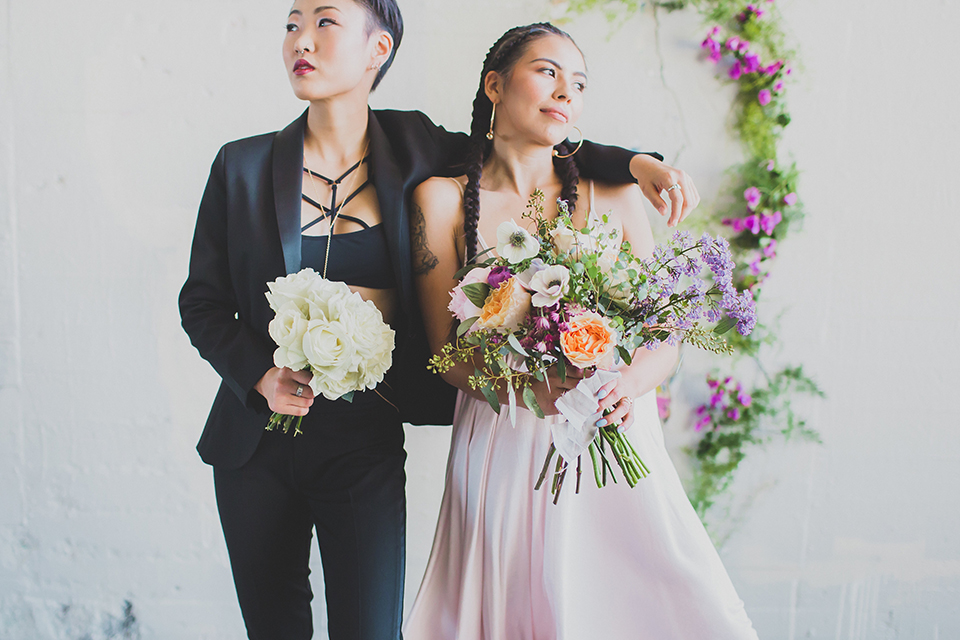 Los-angeles-same-sex-wedding-shoot-brides-hugging-and-holding-bouquet