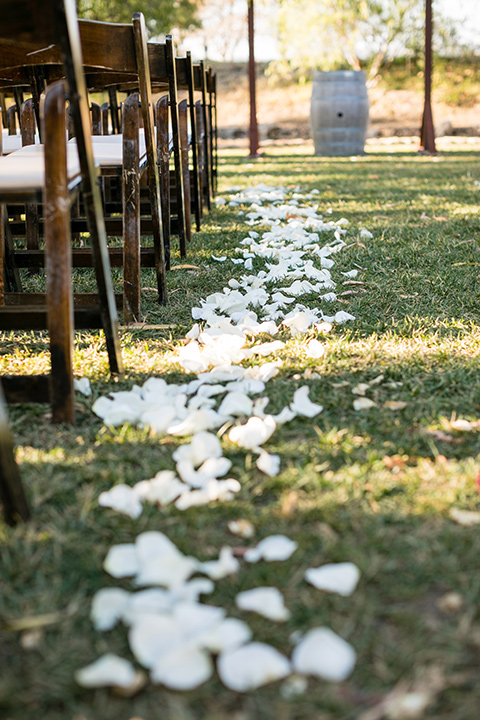 gallway-downs-wedding-ceremony-chairs-and-white-rose-petals-on-the-floor