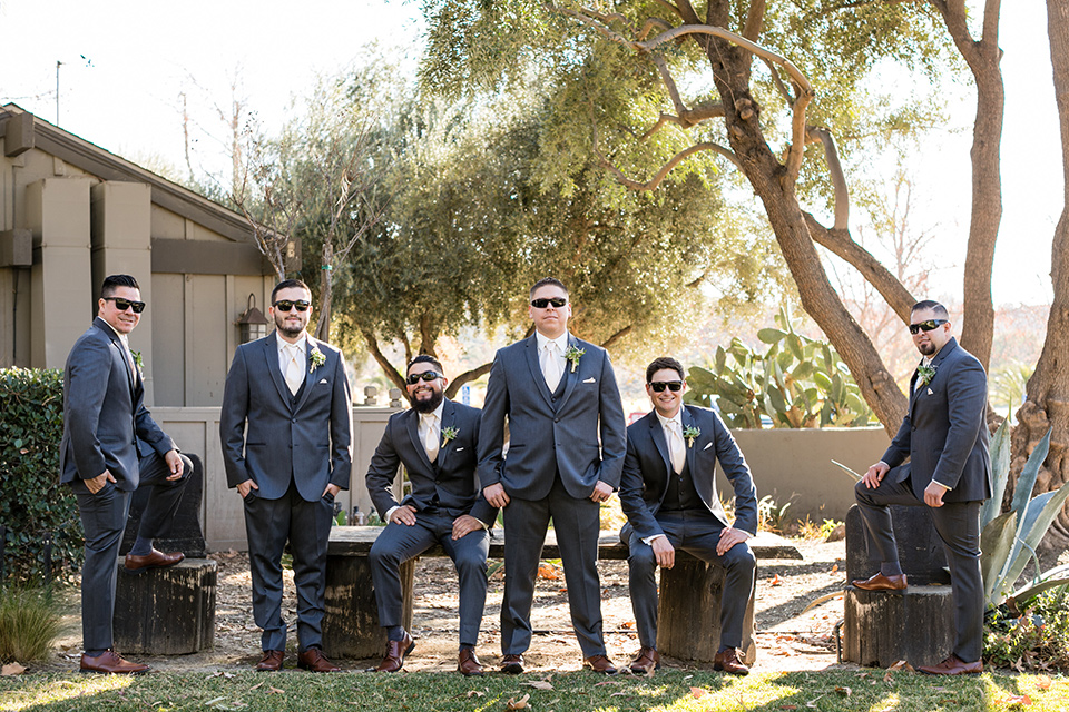 gallway-downs-wedding-groomsmen-groom-in-a-charcoal-tux-withan-ivory-long-tie-groom-in-a-charcoal-grey-tuxedo-with-a-blush-tie-and-his-groomsmen-matching