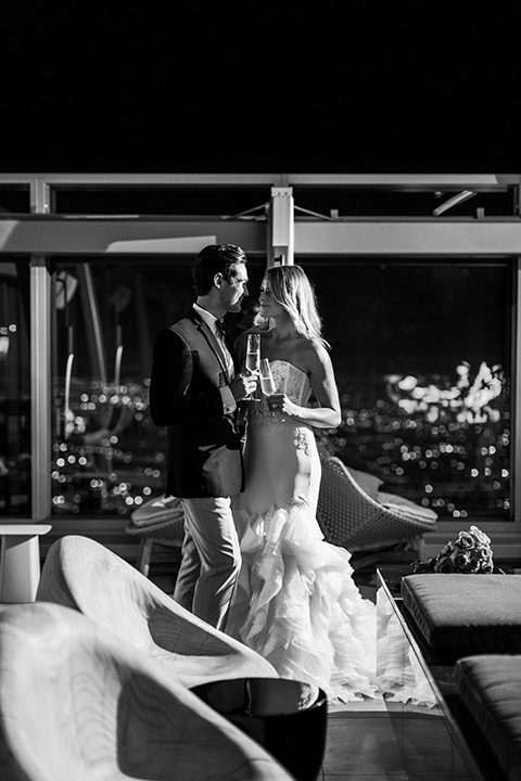 Intercontinental-DTLA-shoot-bride-and-groom-black-and-white-photo-with-champagne