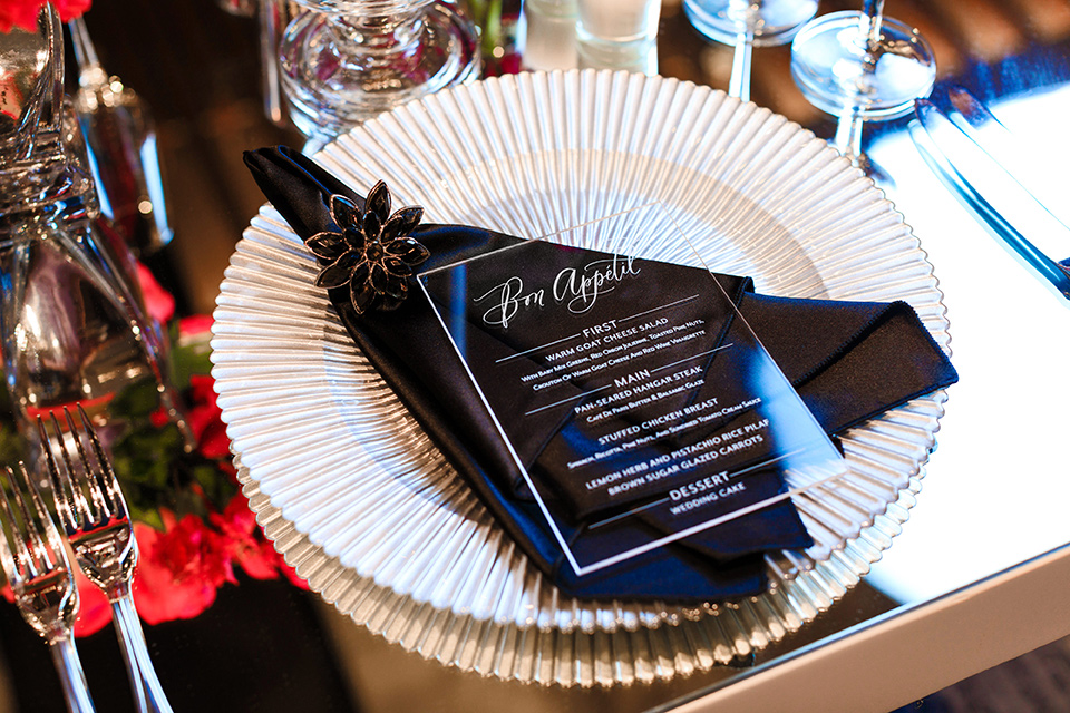 Intercontinental-DTLA-shoot-table-setting-with-whtie-and-gold-charger-plates-black-and-white-menue-cards-and-silver-decor