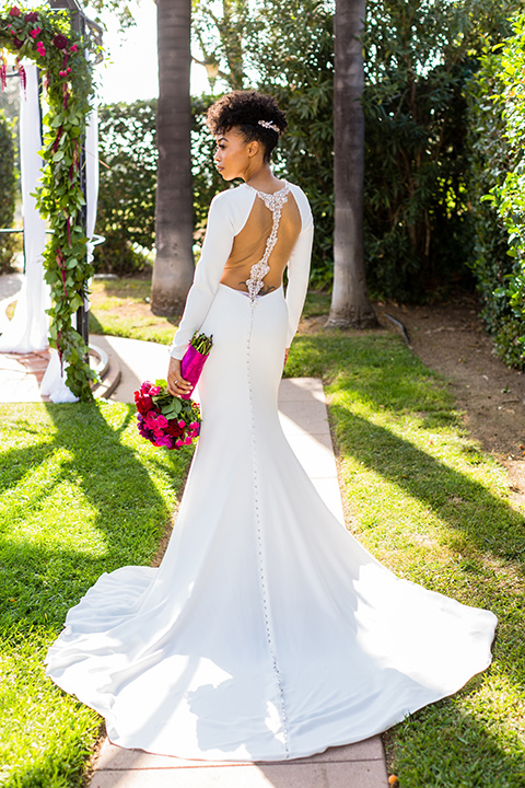 muckenthaler-mansion-bride-alone-in-a-long-white-satin-gown-with-sleeves