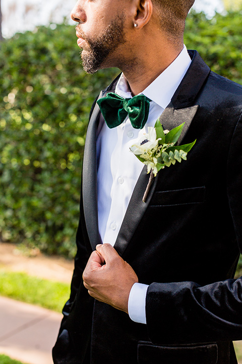 muckenthaler-mansion-close-up-on-groom-look-groom-in-a-black-velet-tux