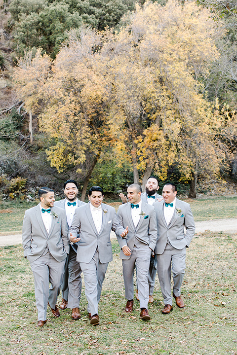 hidden-acres-wedding-groomsmen-walking-all-in-light-grey-suits