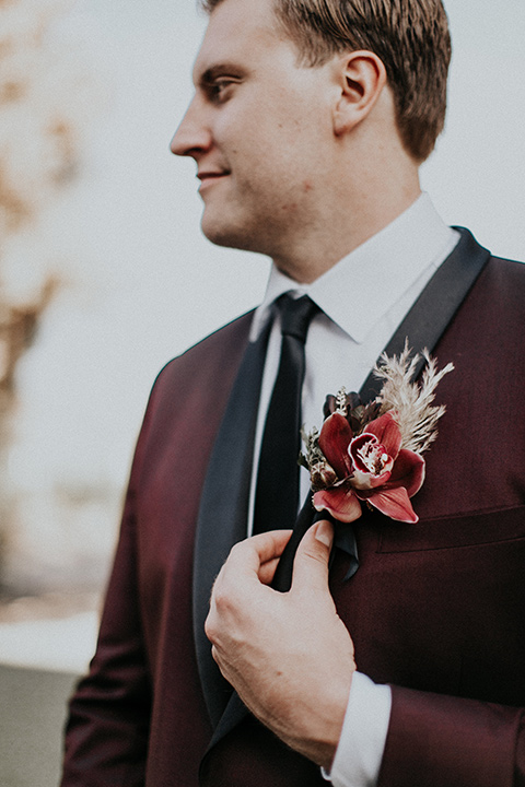 orange-county-vow-renewal-groom-alone-groom-in-a-burgundy-tuxedo-with-a-black-shawl-lapel