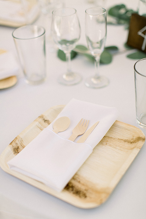  white linens and gold flatware and decor 