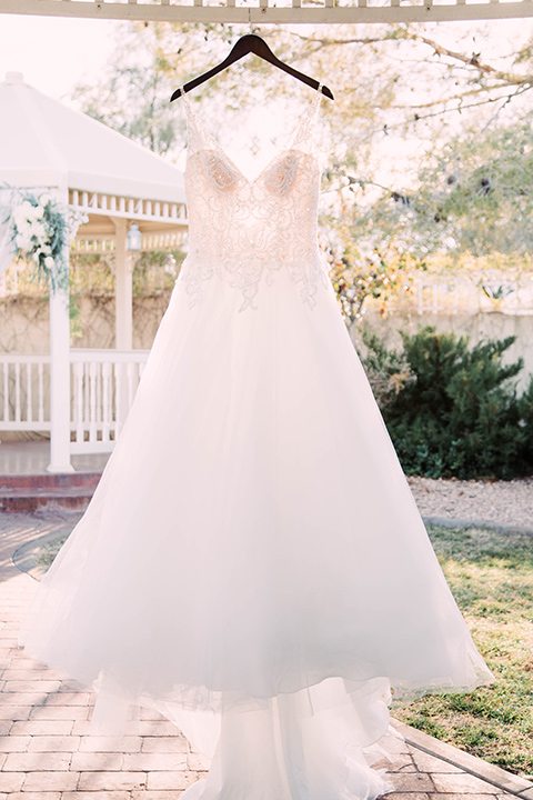 little-chapel-on-the-corner-las-vegas-wedding-shoot-bridal-gown-hanging-outside-it-is-a-full-tulle-ballgown