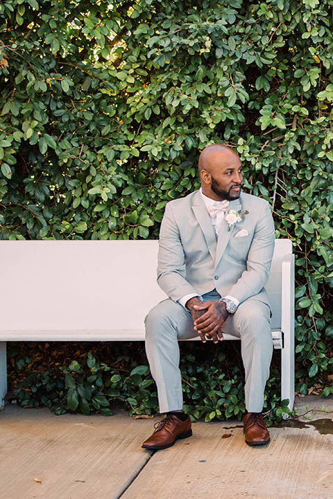 little-chapel-on-the-corner-las-vegas-wedding-shoot-groom-alone-wearing-a-light-grey-tux-with-a-blush-bow-tie