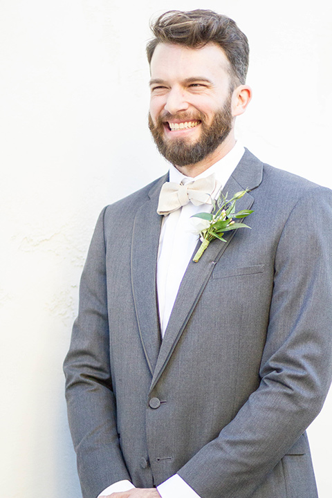 luce-loft-groom-alone-close-up-groom-in-a-charcoal-suit-with-champagne-bow-tie