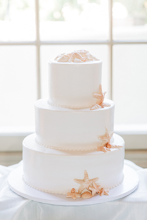 San-Diego-Beach-wedding-cake-with-white-fondant-and-seastar-shapes