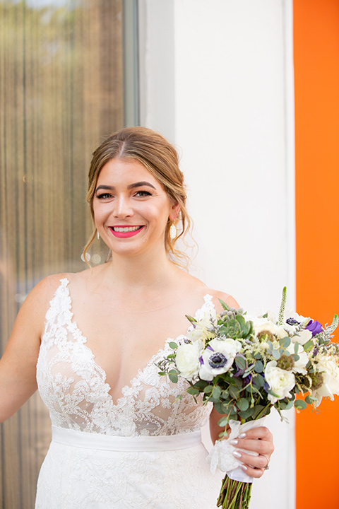 Palm-Springs-wedding-at-the-parker-close-up-of-bride-alone-in-a-flowing-gown-and-a-deep-v-neckline