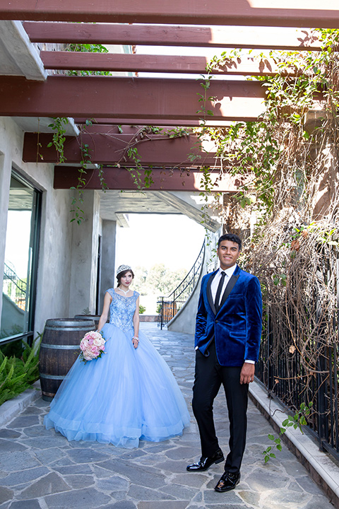 quince-shoot-birthday-girl-in-a-baby-blue-cinderella-dress-chambelan-in-a-royal-blue-vlevet-tuxedo-for-a-cinderella-inspired-quince