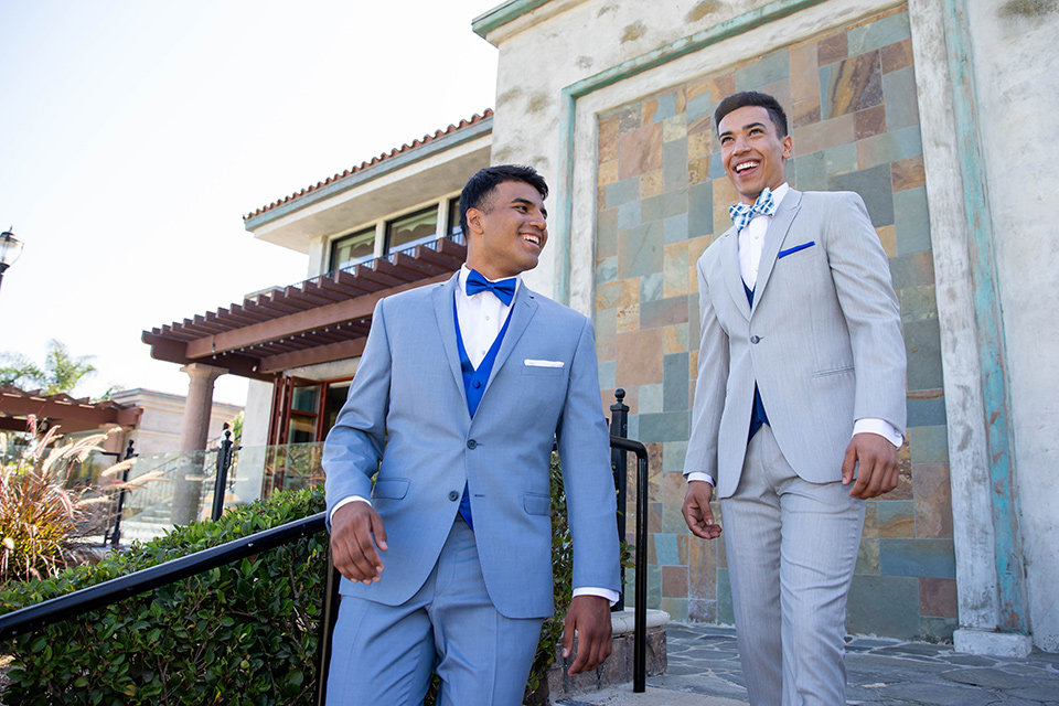 quince-shoot-one-model-in-a-light-grey-suit-with-blue-accessories-other-model-in-a-light-blue-suit-both-with-blue-accessories