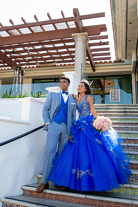 quince-shoot-shades-of-blue-color-scheme-birthday-girl-in-a-blue-gown-and-boy-in-a-blue-suit-with-blue-acessories