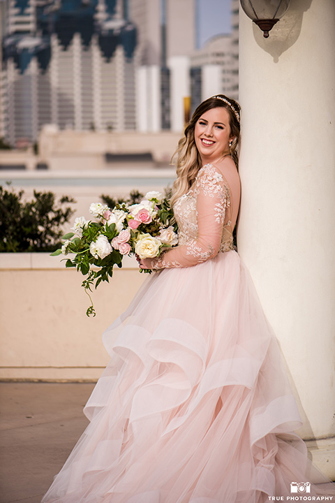 hyatt-san-diego-wedding-bride-looking-at-camera-in-a-blush-toned-ballgown