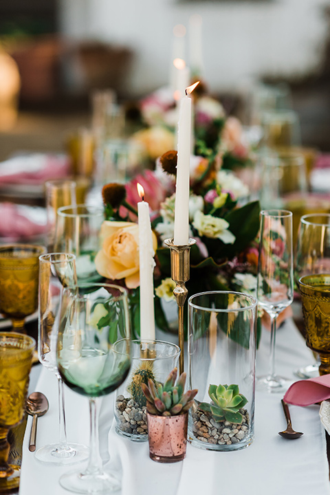 Olivas-Adobe-spanish-inspired-shoot-candles-with-white-linens-on-the-table-and-muted-color-glassware