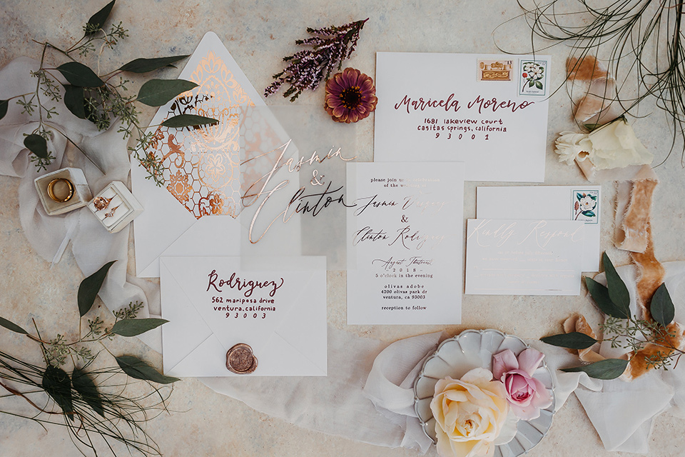 Olivas-Adobe-spanish-inspired-shoot-invitations-with-white-paper-and-rose-colored-cursive