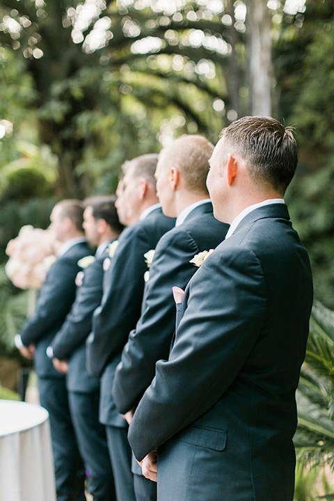 tropical-wedding-at-the-grand-tradition-groomsmen-at-ceremony-in-blue-suits