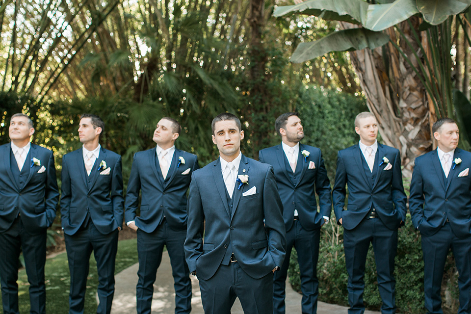 tropical-wedding-at-the-grand-tradition-groomsmen-facing-camera-in-navy-blue-suits