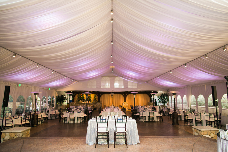 tropical-wedding-at-the-grand-tradition-reception-space-with-draping-white-linens-and-fun-purple-lights