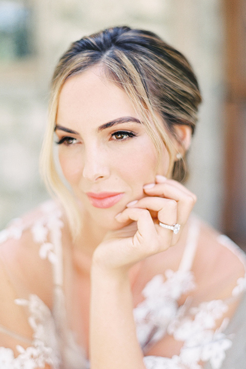 whispering-rose-shoot-bride-standing-alone-bride-wearing-a-strapless-gown-with-pink-shoes