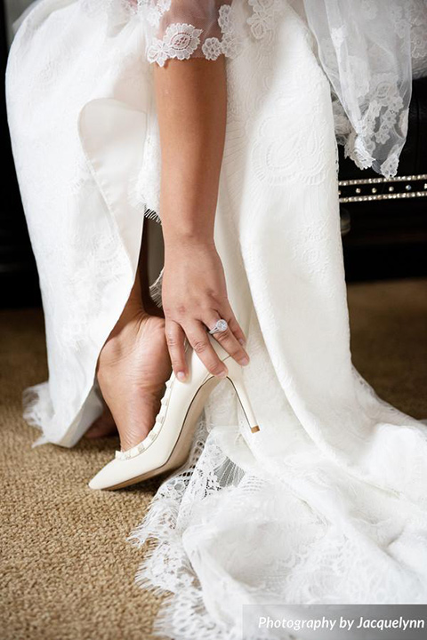  bride wearing white pointed toe shoes