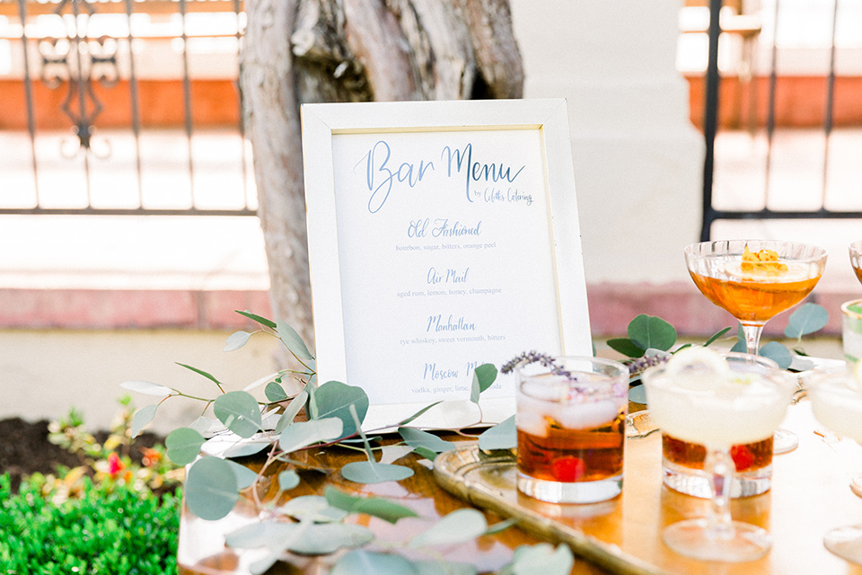  gold bar cart with cocktails 