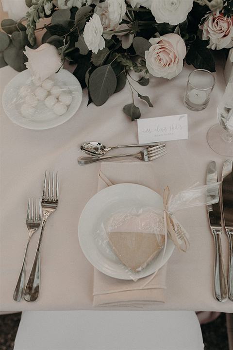  white table linens and silverware