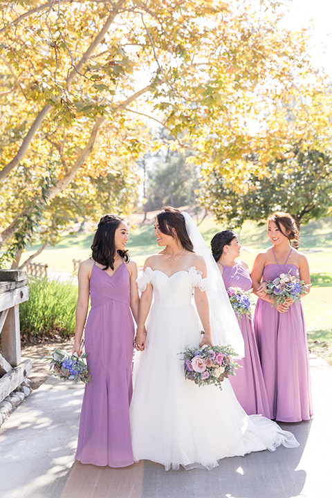  bridesmaids dresses in lilac colors with different necklines 