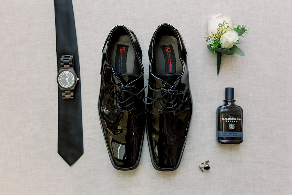  black tuxedo shoes with a black long tie and watch