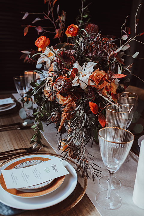 white and terracotta plates with autumn boho style flowers