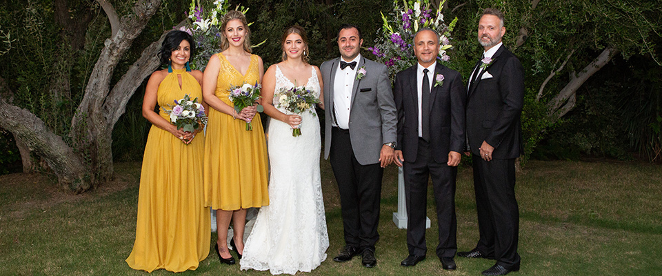  sunny-marigold-yellow-bridesmaids-gowns-and-the-groom-in-a-charcoal-framed-tux-and-groomsmen-in-black-suits